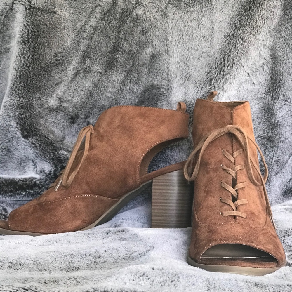 Open-toe, open-back heeled boots.